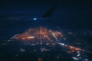 Out the window of an airplane over the city of Detroit shot by Ryan Lockwood